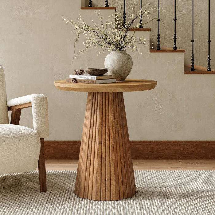 Solid wood round pedestal side table styled with flowers and books beside a sofa#Color_Rustic Brown