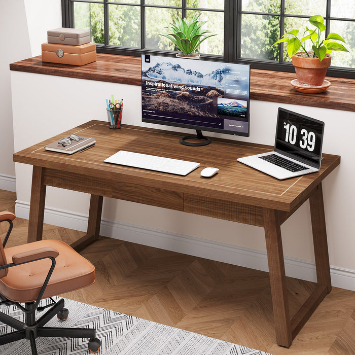 Mid-century modern wood computer desk with walnut finish and drawer styled in a home office workspace