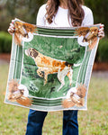 woman holding a green scarf with bird dog design