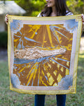 Person holding a decorative fabric with nature-themed alligator and palmetto design